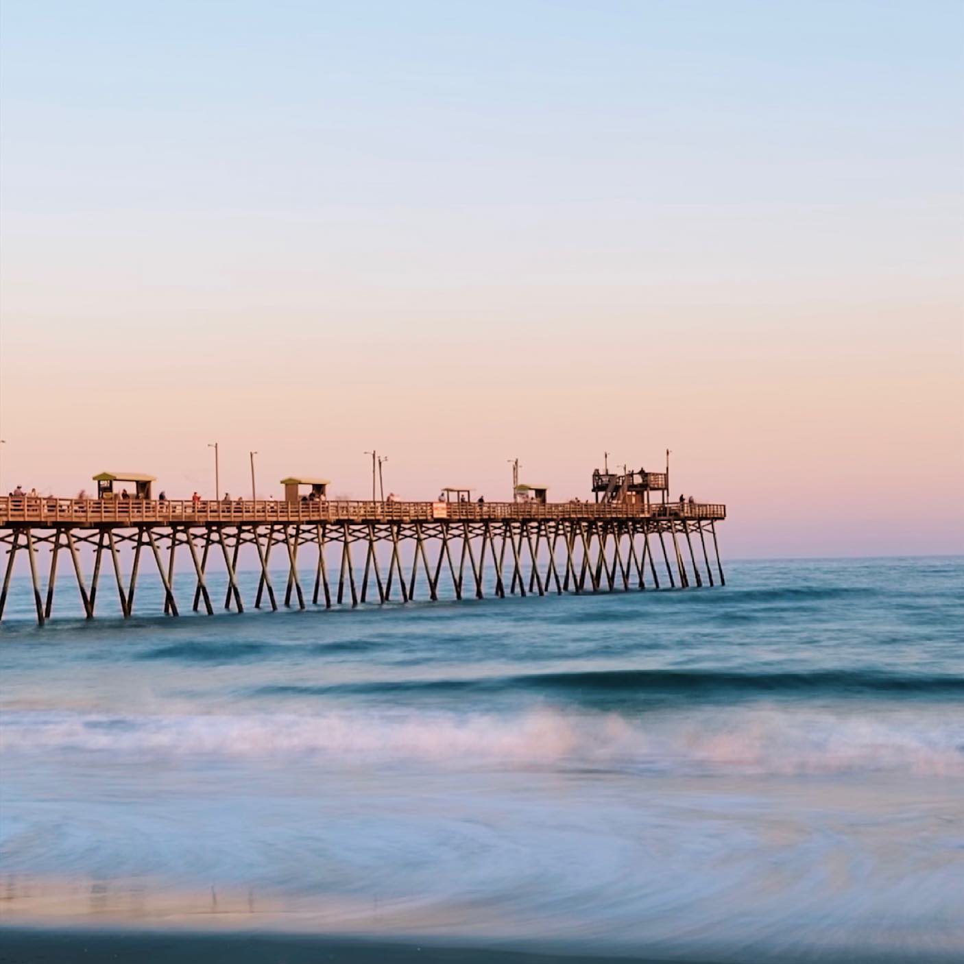 Emerald Isle beach town pier at sunset